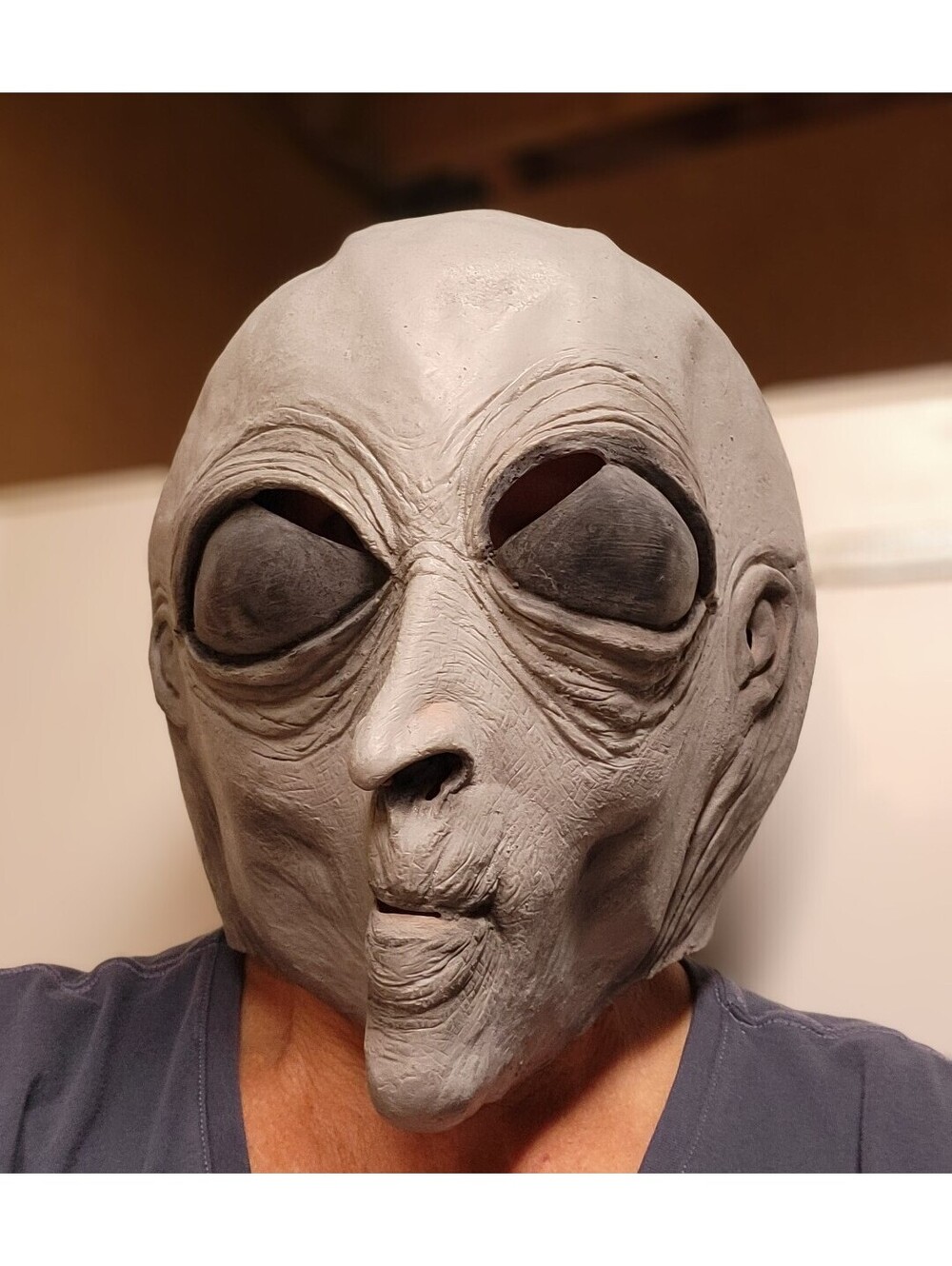 gray latex alien mask with large black eyes and wrinkled facial details adult lg